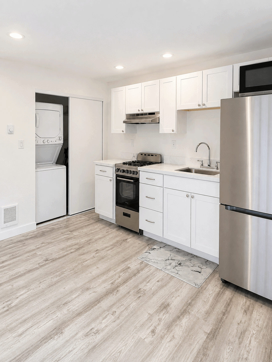 Move-ready empty kitchen with polished appliances and floors