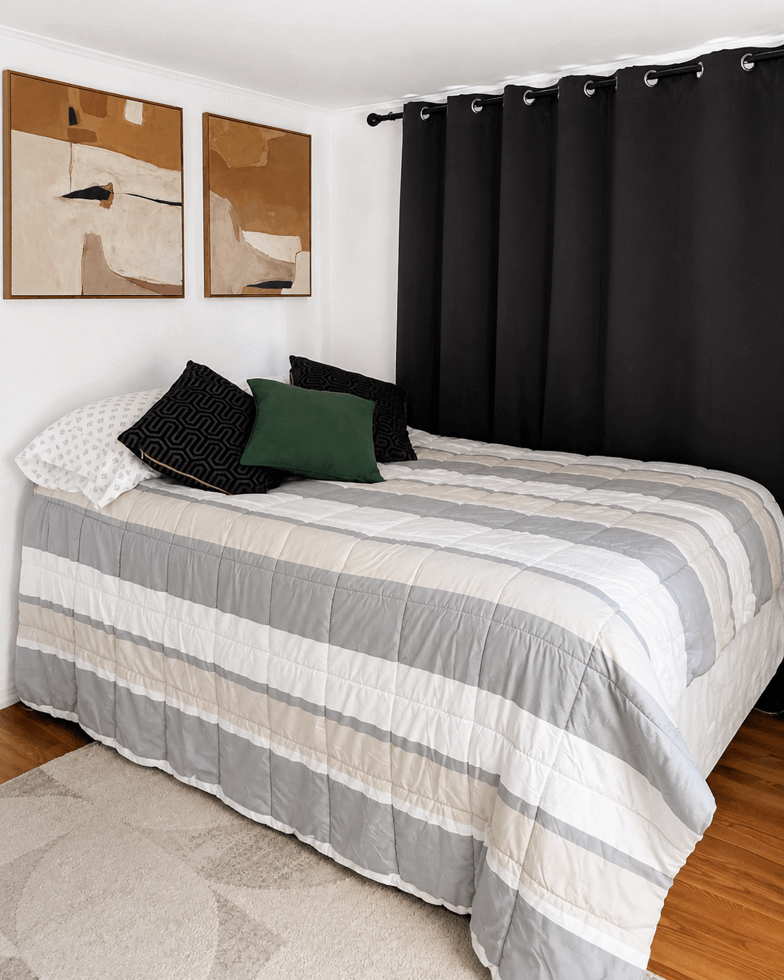 Freshly made bed and tidy bedroom after regular cleaning