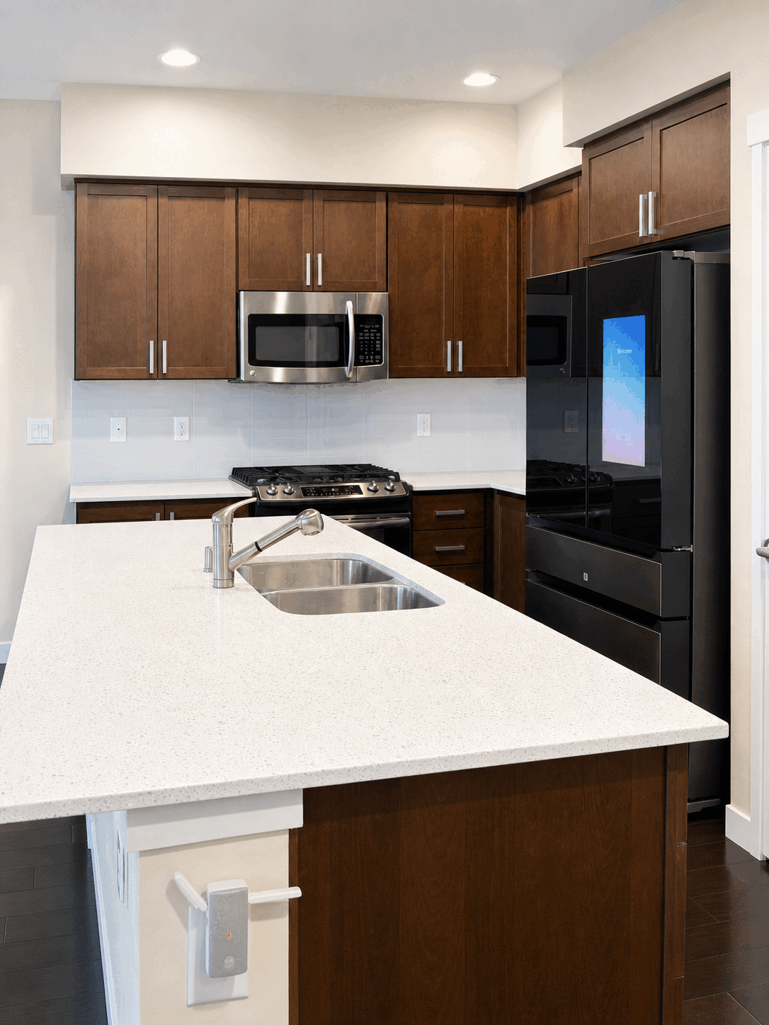 Spotless kitchen island and stainless steel appliances